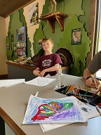 Into the activity center, and time for coloring!