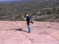 Charlie hiking up the pink granite dome.