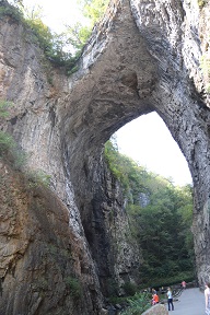 Passing beneath the limestone arch